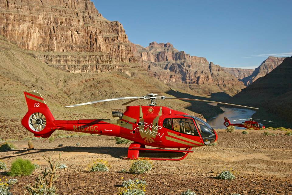 Grand Canyon Helicopter Tours helicopters parked on the base of The Grand Canyon.