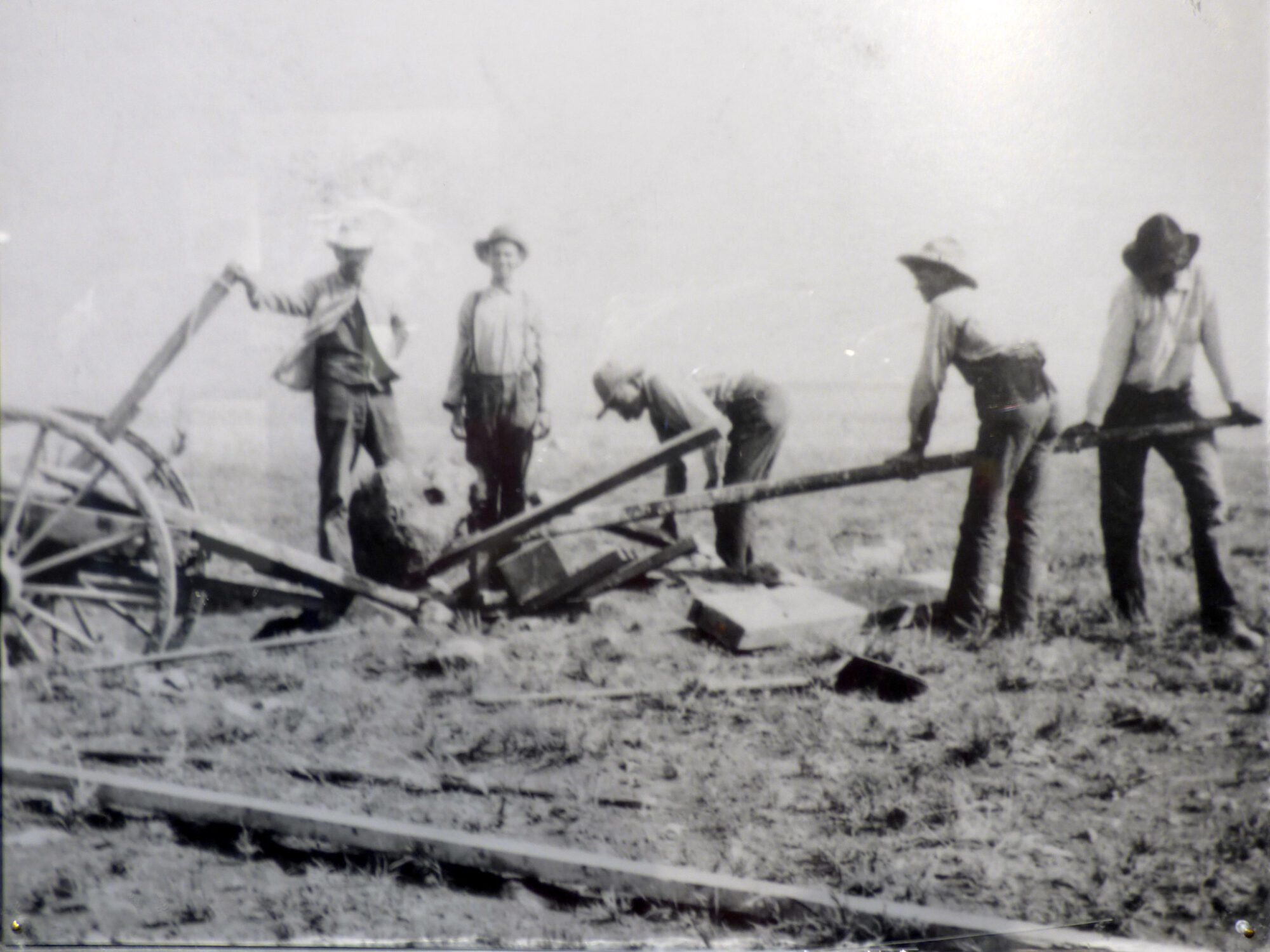 Daniel Moreau Barringer and follow workers digging up the meteorite and loading it on a wagon inside the Meteor Crater.