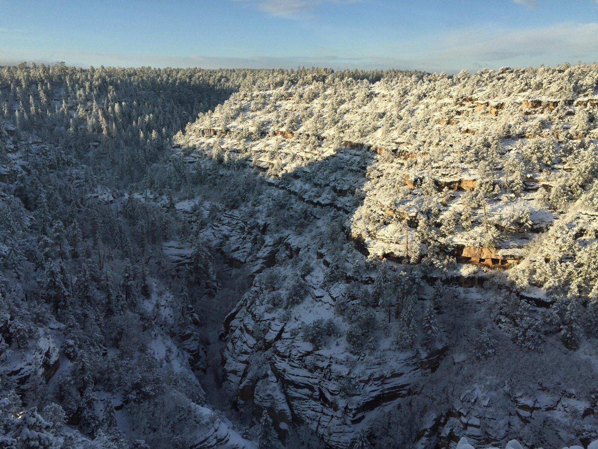 Walnut Canyon National Monument at sunset and covered in light snow.