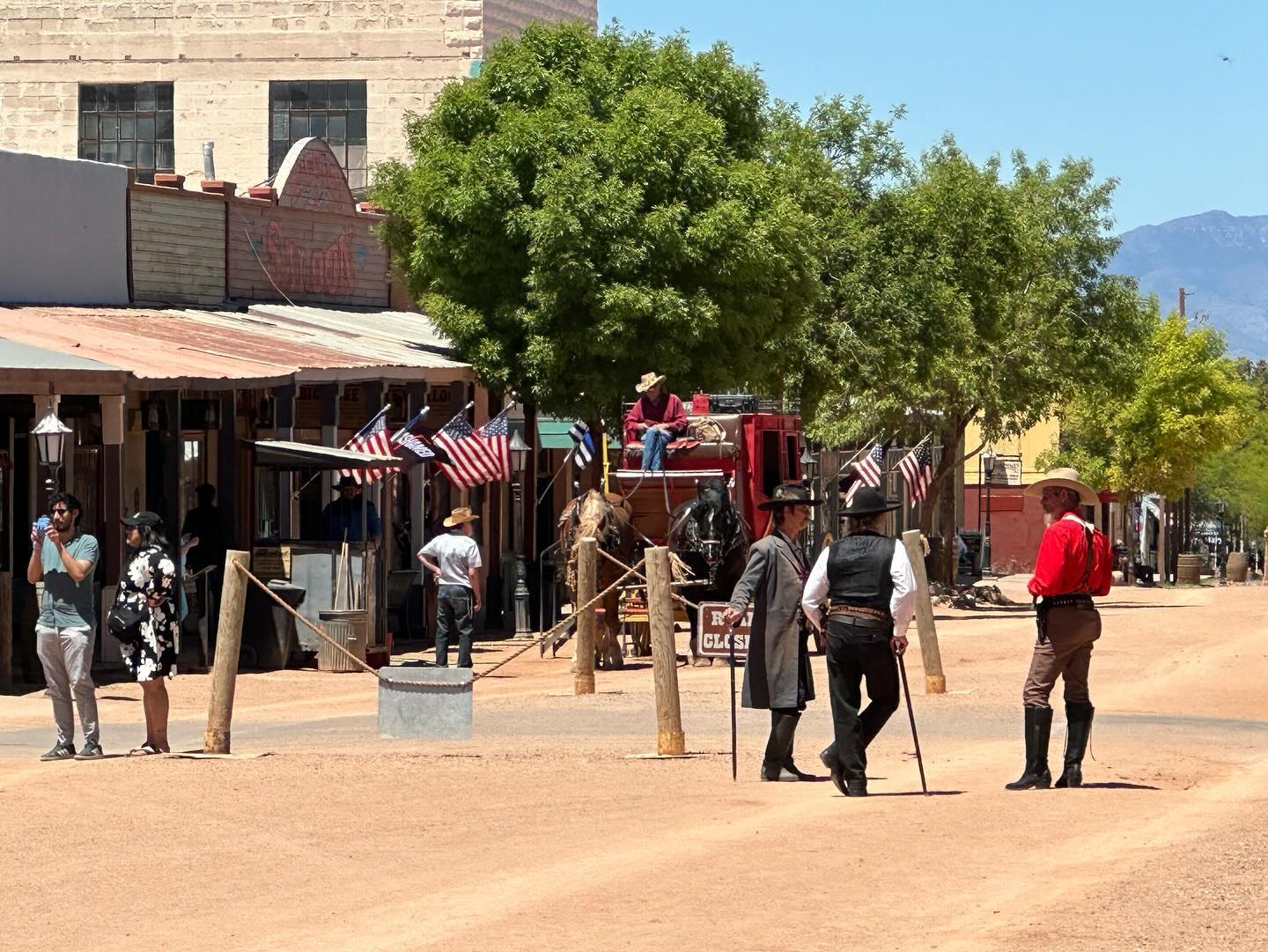 Exterior shot of cowboy performers in the middle of the street in Tombstone, AZ.