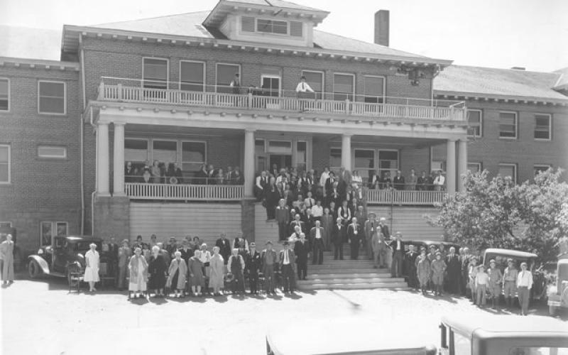 1940's photograph of employees and residents outside of the steps at the Arizona Pioneer's Home in Prescott.