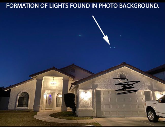 Circular Light Formation in Yuma night sky behind a house.