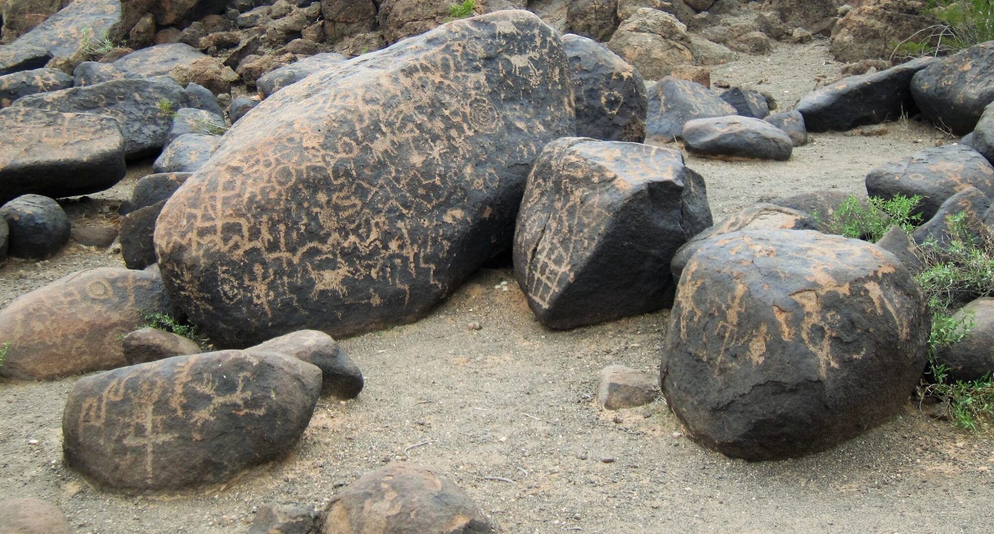 Image of rocks with petroglyphs on them in at the Painted Rock Petroglyph Site in Arizona.